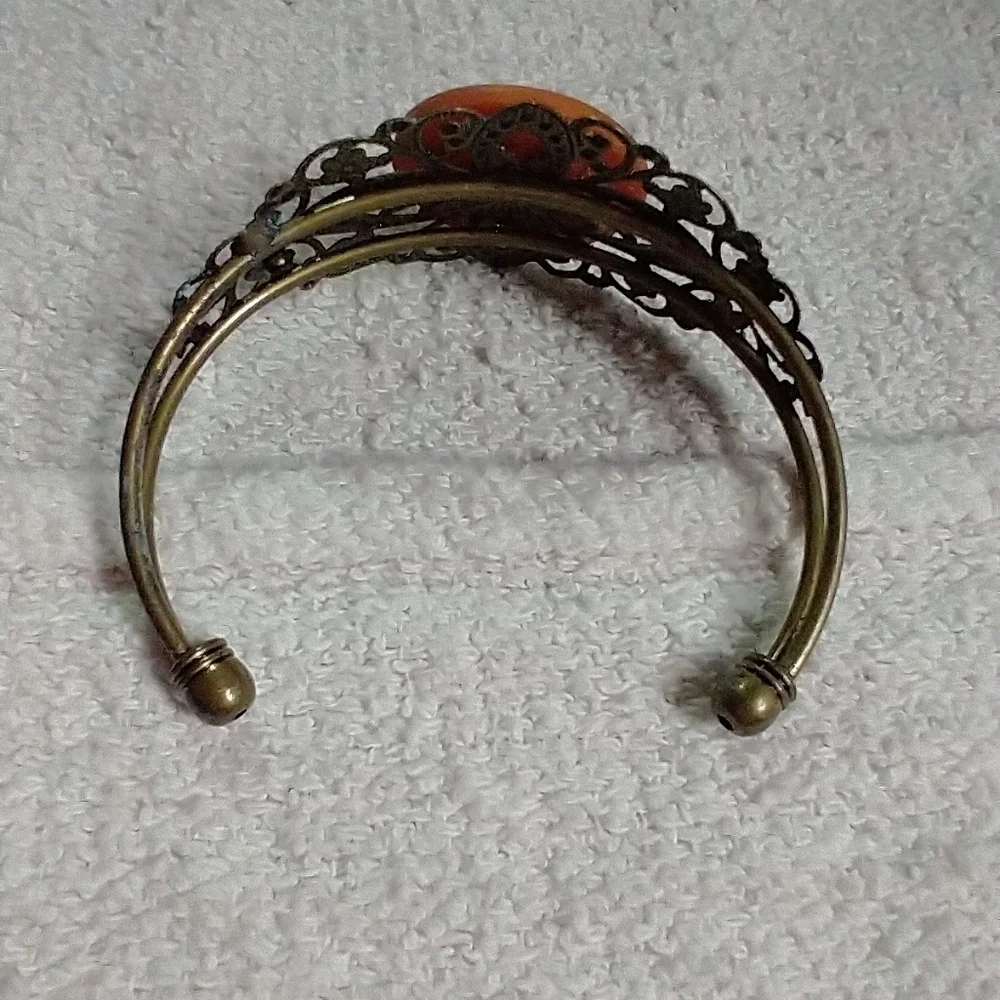Goldtone filigree lacy red orange cuff bracelet